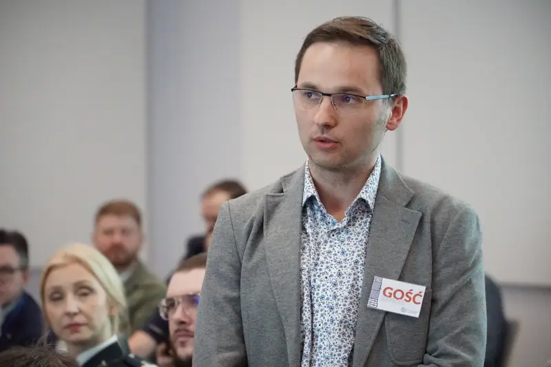 A participant asking a question during the discussion.