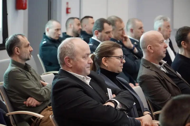 Engaged participants listening to a presentation.